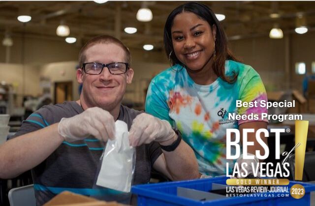 image of two people packaging items in a warehouse, the text 'best special needs program, best of las vegas' in the foreground