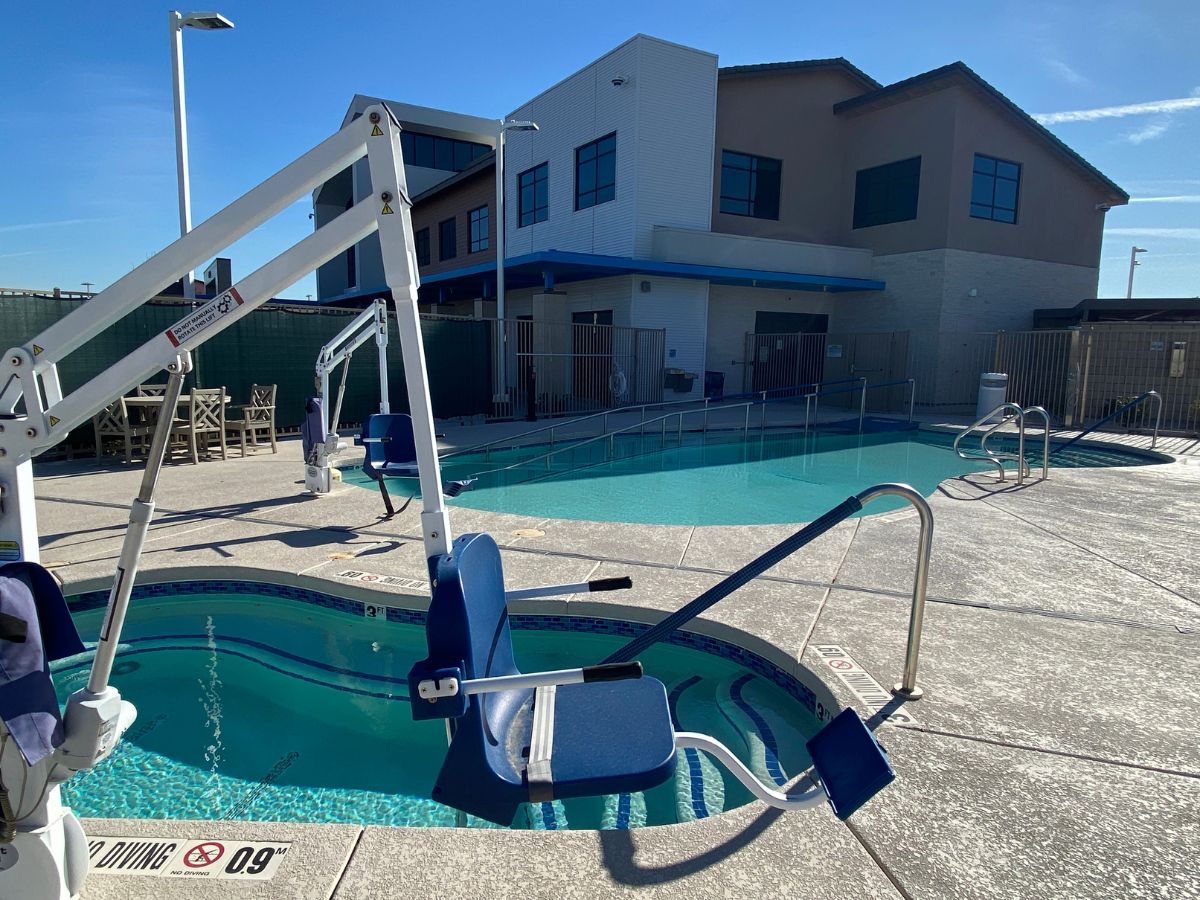 outdoor swimming pools with ada seated hoist equipment