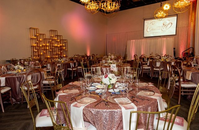 tables in a event hall decorated for a gala